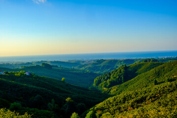 landscape with green mountains and blue sky