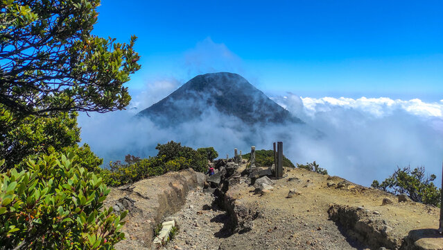 The peak of Mount Gede with views of the crater and Mount Pangrango. for wallpaper background