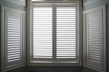 closed window with white shutters