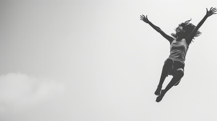 Woman Jumping in Air, Silhouette Against Sky