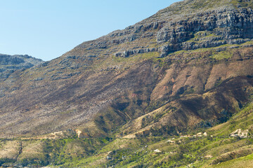 Rock, sustainability and landscape with mountain in nature for ecology, travel and growth. Habitat conservation, ecosystem preservation and biodiversity with blue sky and environment for ecotourism