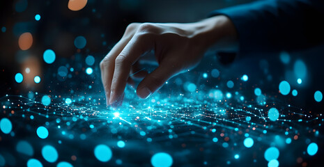 A hand is touching a screen with a blue background