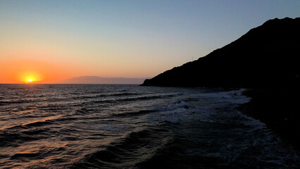 A solitary beacon by the sea  guiding sailors safely along a coastline known for its steep  rocky cliffs