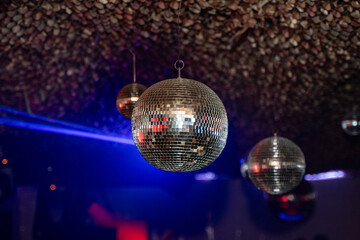 A hanging disco ball in nightclub.