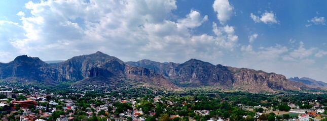 a city with mountains in the background