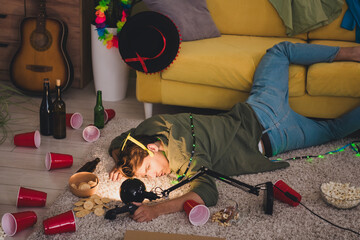 Photo of young drunk guy after party celebration weekend hangover indoors room home house apartment