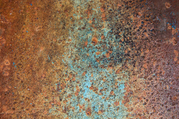 A steel plate filled with reddish-brown rust, is the background for the design idea.