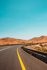 Desert road among the mountains, view of the mountain landscape in the Judean Desert in southern Israel. High quality photo