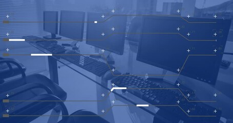 Animation of financial data processing over computers on desks in office and blue background