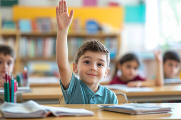 Smiling young boy raising hand to participate in a classroom lesson, surrounded by engaged students