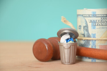 The gavel represents the legal consequences of improper waste management, highlighting the...