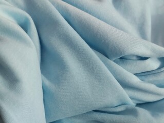 Fototapeta premium abstract wavy background blurred from blue fabric