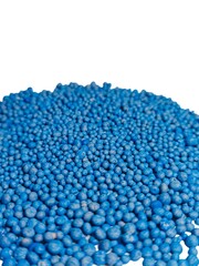 These blue granules are chemical NPK fertilizer