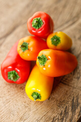 Colorful Sweet Pepper Chili, Baby Small Bell Pepper on wooden background
