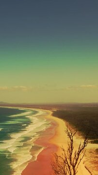 Look out view of Australian coastline smooth sea ocean wave with golden sky effets  vertical video background.
