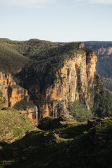 Waterfall in a mountain range surrounded by forest