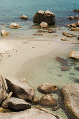 Clear blue water on a white sand beach