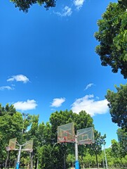 Outdoor Basketball Hoops under a Bright Blue Sky