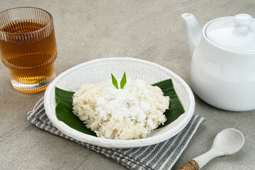 Ketan Kelapa Parut, Indonesian traditional snack, made from steamed glutinous rice and served with grated coconut
