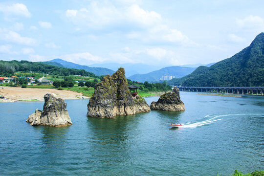 Danyang-gun, Chungcheongbuk-do, South Korea - August 12, 2018: Motor boat is passing by Dodamsambong Peaks
