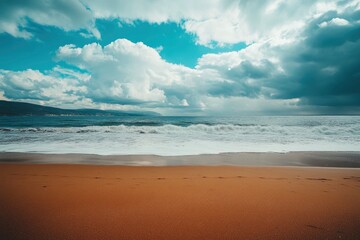 Fototapeta premium sea and cloudy sky with beach sand in the foreground , ai