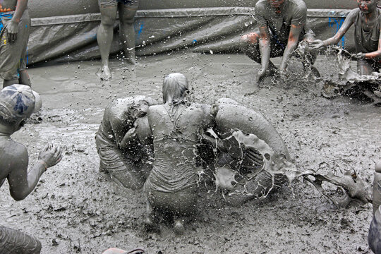 Daecheon Beach, Boryeong-si, Chungcheongnam-do, South Korea - July 19, 2014: Young people are having fun with muds at Boryeong Mud festival