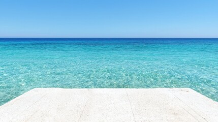 Fototapeta premium Concrete Platform Overlooking Turquoise Ocean Water