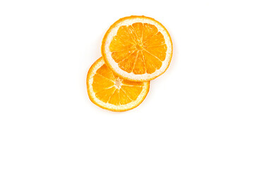 Two fruity orange slices overlapped isolated over white