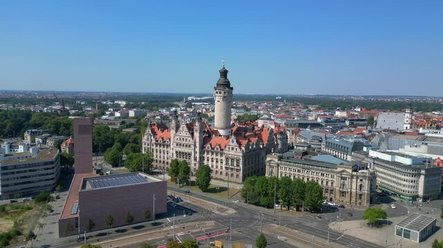 leipzig new city hall, a stunning example of german renaissance architecture, surrounded by the bustling city on a bright summer day. Spectacular aerial view flight panorama orbit drone