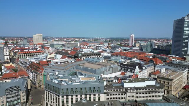 leipzig new city hall, a stunning example of german renaissance architecture, surrounded by the bustling city on a bright summer day. Majestic aerial view flight fly reverse drone