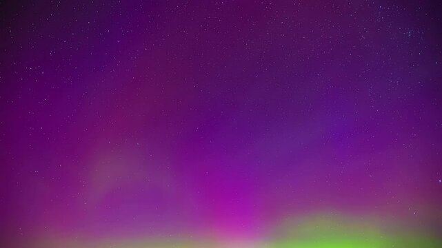 Star shooting through the magical purple sky of the North
