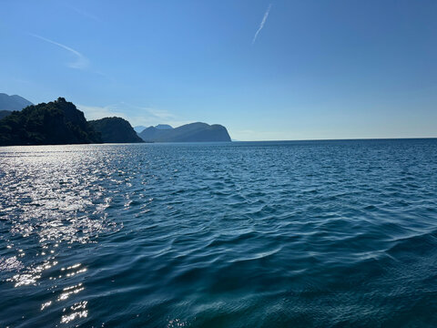 Sea blue glittering waters and sky.