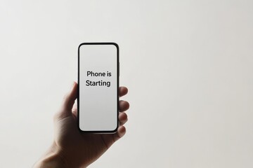 a man holding a phone and the screen showing the text " phone is starting" , illustrating phone is booting up