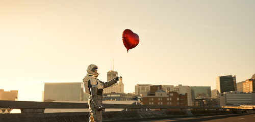 Astronaut, outdoor and tourism of planet, space and suit for protection, explore or mission in universe. Travel, love and person in trip, mockup and balloon for return to earth and science fiction