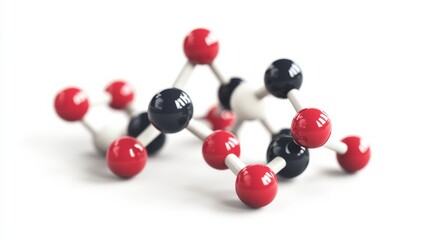 Close-up of a molecular structure model with red and black spheres connected by white rods, on a white background.