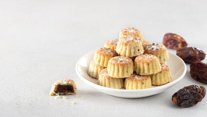 Arabic oriental cookies dates maamoul eid al fitr on a white background. Copy space.