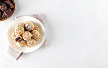 Arabic oriental cookies dates maamoul eid al fitr on a white background. Copy space.