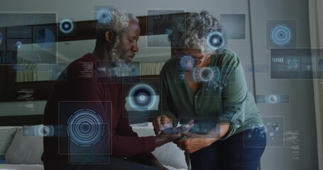 Animation of data processing over senior african american couple cleaning hand - Powered by Adobe