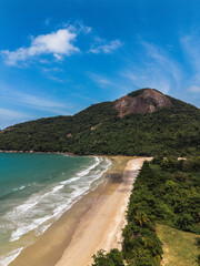 Aerial pictures from a beach from Isla grande brasil angra dos reis rio de janeiro paradise beach with mountains and waves to surf in a sunny day