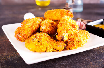 Fried chicken wings on white plate