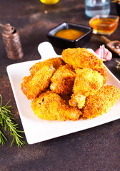 Fried chicken wings on white plate