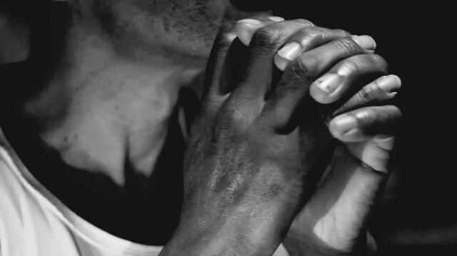 man praying to god Caribbean man praying with hands together with background stock video stock footage