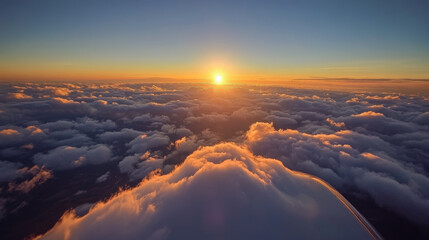 A stunning sunset over the Blue Ridge Mountains, seen from a private plane. The sky is filled with clouds.