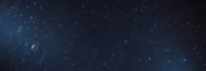 a dark, starry night sky with numerous small, blurry stars scattered across the frame, creating a sense of depth and vastness.