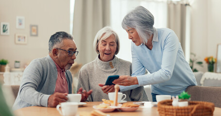 Smartphone, tea and senior friends at table for funny meme, snacks and retirement together in house. Group, surprise and man with elderly women for breakfast, happiness and excited with smile