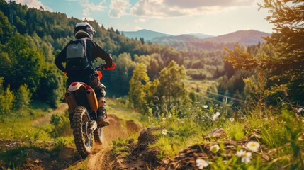 Naklejka premium Man Riding Dirt Bike on Hill