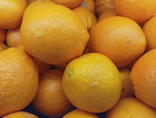 Close-up of Ripe Oranges in a Pile