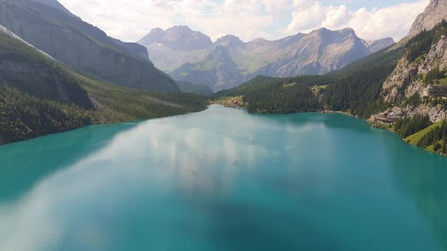 Aerial footage of the scenic Alpine Oeschinen Lake (Oeschinensee) in Kandersteg, Switzerland