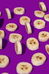 Banana slices on a purple surface
