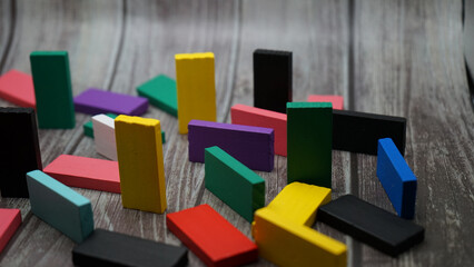 colorful bricks on white backgrounds in different positions and shapes making buildings